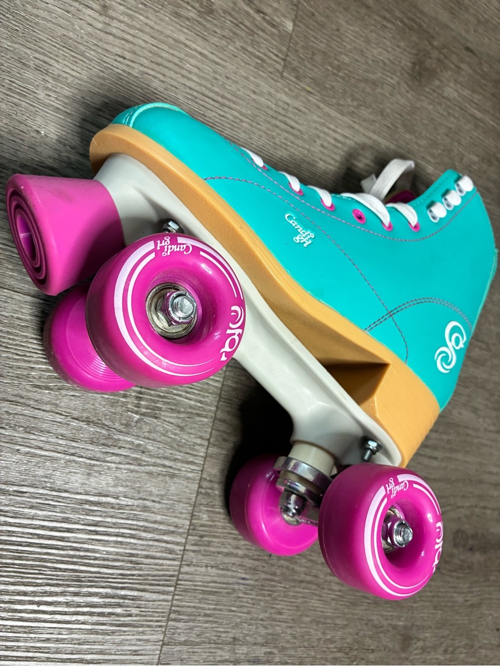 Crazy 8 Turquoise Roller Skates with Pink Wheels and Yellow Sole
